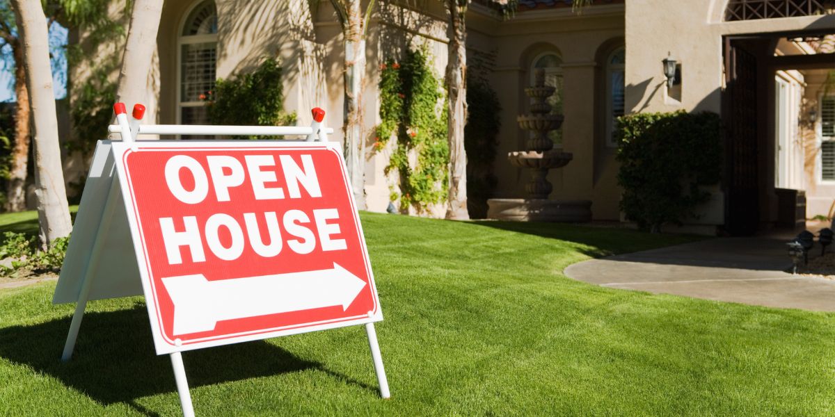 open house sign on the lawn
