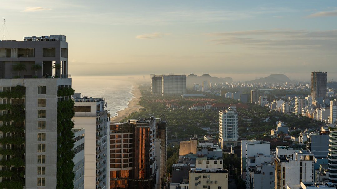 Panoramic view of a city skyline at sunset.