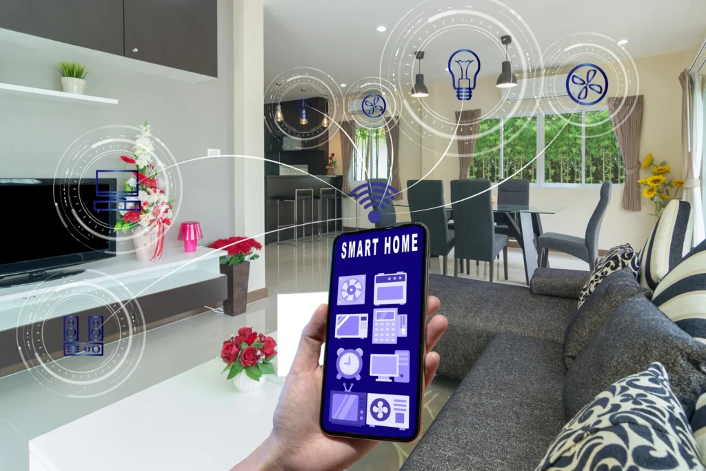 Smart home and augmented reality technology concept hand holding smart phone presenting the smart home control screen and ...