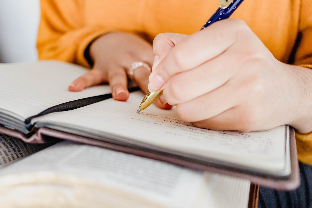 A hand holding a pen checking off tasks on a detailed checklist, symbolizing a comprehensive process.. Photo by Sincerely Media on Unsplash. A hand holding a pen checking off tasks on a detailed checklist, symbolizing a comprehensive process.