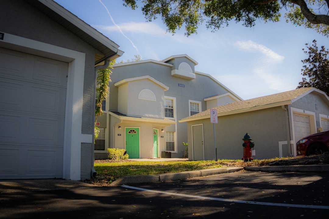 The clean, modern exterior of a beautiful suburban home on a bright, sunny day, representing the successful outcome of a seamless relocation.