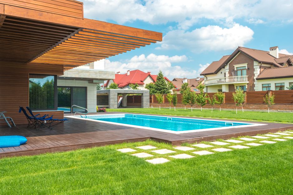 The beautiful exterior of a modern suburban home on a bright, sunny day, representing the ideal outcome of a successful, high-value home sale in a desirable neighborhood like Kennewick.